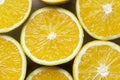 oranges in halves on a wooden plate