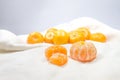 The fresh oranges put on a white cloth as a background. Royalty Free Stock Photo