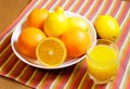 Oranges, lemons and glass of orange juice Royalty Free Stock Photo