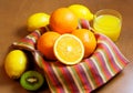 Oranges, lemons, kiwi and glass of orange juice Royalty Free Stock Photo