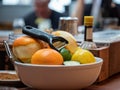 Oranges, limes, and lemons for peeling sitting in a bowl on bar to create drinks Royalty Free Stock Photo