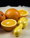 Oranges next to orange slices. Orange juice and oranges Royalty Free Stock Photo