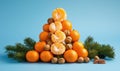 Oranges and nuts pyramid arrangement with pine branches Royalty Free Stock Photo