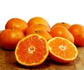 Oranges and one cut into halves sweet seedless oranges Royalty Free Stock Photo