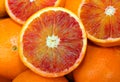 Oranges and an orange cut in the stall of greengrocer Royalty Free Stock Photo
