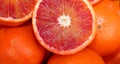 Oranges and an orange cut in the stall of greengrocer Royalty Free Stock Photo