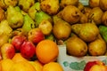 Oranges and pears close-up. Fruit stall at the farmers market. Bright ripe fruits of plants are laid out for sale. Small Royalty Free Stock Photo