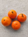 oranges placed on a white board