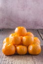 Oranges placed on a wooden floor.