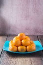 Oranges placed on a wooden floor.