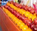 Oranges and pomgranades rows stacked on top of each other