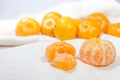 Oranges put on a white cloth as background. Royalty Free Stock Photo