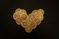 Oranges in shape of heart, black background