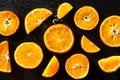Oranges, sliced on a black background Royalty Free Stock Photo