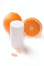 Oranges, vitamin pills and container isolated Royalty Free Stock Photo