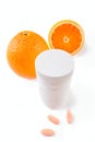 Oranges, vitamin pills and container isolated Royalty Free Stock Photo