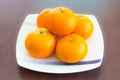 Oranges on the white dish