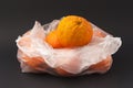 Oranges in a white envelope on a black background Royalty Free Stock Photo