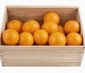 Oranges in a wooden box , isolated on white background Royalty Free Stock Photo