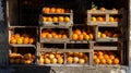 Oranges in wooden crates casting dramatic shadows Royalty Free Stock Photo