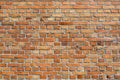 Orangey red brick wall background Royalty Free Stock Photo