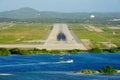 Aerial view of the plane runway of Queen Beatrix International Airport by the ocean near Oranjestad, Aruba