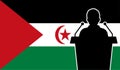 Orator Speaking From Tribune Sahrawi Arab Flag Background. Public Speaker Speech In Sahrawi Arab