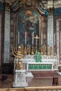 Oratory London Candlestick for seven candles with altar in background