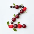 Orbanic fruits pattern of letter Z english alphabet from natural ripe berries - black currant, cherries, raspberry, mint Royalty Free Stock Photo