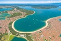 The Orbetello lagoon with the city located on the small peninsula in the middle of the lake can be seen from the air.