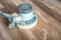 Orbital polishing machine sanding parquet floor Royalty Free Stock Photo