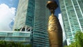 orbiting footage of the Egyptian Sphinx at Maurice A. Ferre Park with high rise hotels, skyscrapers and office buildings, lush