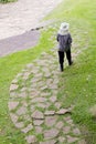 Orchardist walk alone on way brick in public garden Royalty Free Stock Photo