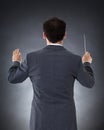 Orchestra conductor with baton Royalty Free Stock Photo