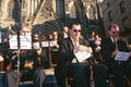 An orchestra performing outside of Santa Eulalia