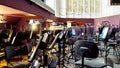 Orchestra pit of the Opera and Ballet Theatre. A break in the rehearsal of musicians in the orchestra pit. Music stands, chairs,