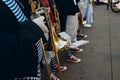 orchestral musicians in sneakers and striped T-shirts with trumpets in their hands