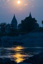 Orchha cityscape from the river at sunset, temple silhouette. Also spelled Orcha, famous travel destination in Madhya Pradesh, Ind