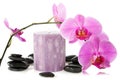 Orchid,aromatic candle and black stones