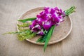 Orchid Bouquet in placemat on sackcloth