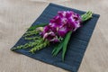 Orchid Bouquet in placemat on sackcloth