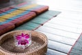 orchid flower in glass. Thai backrest pillow on mat. Thailand sc