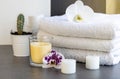 Orchid flowers, spa items, towels isolated on white background with copy space, bathroom. Royalty Free Stock Photo