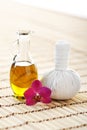 Orchid, jar with oil and massaging ball Royalty Free Stock Photo