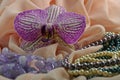 Orchid flower, jewelry and silk