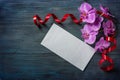 Orchid and a white envelope Royalty Free Stock Photo