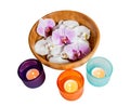 Orchids in bowl and candles isolated on white. Selective focus Royalty Free Stock Photo
