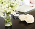 Orchids in vase on pretty bedside table square