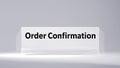 Order confirmation message on a simple backdrop indicating completion of purchase