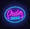 Order here neon sign on brick wall background.